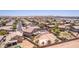 A bird's-eye view of a home with a pool, bocce ball court, sport court, and desert landscaping at 36645 W Bilbao St, Maricopa, AZ 85138