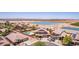 Wonderful aerial view of several desert homes and a neighborhood lake at 36645 W Bilbao St, Maricopa, AZ 85138