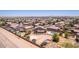 Aerial shot of large home with a well-appointed backyard featuring bocce ball, a pool and sport court at 36645 W Bilbao St, Maricopa, AZ 85138
