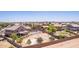 Fantastic aerial view showcases a private pool, a gazebo, desert landscaping, and a sport court at 36645 W Bilbao St, Maricopa, AZ 85138
