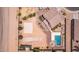 Aerial shot of an estate's private backyard featuring pool, fireplace, putting green, bocce ball and sport court at 36645 W Bilbao St, Maricopa, AZ 85138