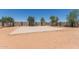 Backyard features a basketball court with space for games, practice, and outdoor activities at 36645 W Bilbao St, Maricopa, AZ 85138