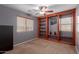 Bedroom features gray walls and a custom wood bookcase at 36645 W Bilbao St, Maricopa, AZ 85138