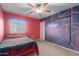 Bedroom features bright colors, carpet and modern styling at 36645 W Bilbao St, Maricopa, AZ 85138