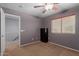Bedroom features gray walls, carpet and a window with coverings at 36645 W Bilbao St, Maricopa, AZ 85138