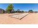 Backyard bocce ball court area perfect for outdoor games and entertainment on a sunny day at 36645 W Bilbao St, Maricopa, AZ 85138