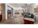 Open-concept living room featuring ample seating and seamless flow into the kitchen and dining areas at 36645 W Bilbao St, Maricopa, AZ 85138
