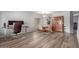 Open-concept living area with hardwood floors, natural light, and views of the backyard at 36645 W Bilbao St, Maricopa, AZ 85138