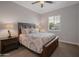 Well-lit primary bedroom with a comfortable king bed, side tables, and a bright window at 3907 E Carob Dr, Gilbert, AZ 85298
