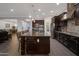 Beautiful kitchen with stainless steel appliances, tile backsplash, granite counters, and a large center island at 3907 E Carob Dr, Gilbert, AZ 85298