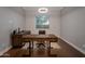Home office featuring natural light, a large desk, wood floors and updated lighting at 3907 E Carob Dr, Gilbert, AZ 85298