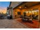 Covered patio includes an outdoor kitchen and dining area perfect for entertaining and enjoying outdoor meals at 3907 E Carob Dr, Gilbert, AZ 85298