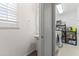 Powder room with pedestal sink and access to laundry area and storage at 45722 W Barbara Ln, Maricopa, AZ 85139