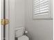 Half bath featuring white fixtures and a bright window at 45722 W Barbara Ln, Maricopa, AZ 85139