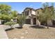 Charming two-story home with desert landscaping and a stone pathway leading to the front door at 45722 W Barbara Ln, Maricopa, AZ 85139