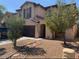 Charming two-story home with a well-maintained yard and attached garage at 45722 W Barbara Ln, Maricopa, AZ 85139