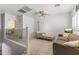 Cozy loft with neutral carpet, ceiling fan, and comfortable seating with a small TV at 45722 W Barbara Ln, Maricopa, AZ 85139
