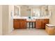 Bathroom with double vanities, a makeup area, and ample storage space at 4614 E Reins Rd, Gilbert, AZ 85297