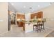 Open kitchen features dual islands, stainless appliances and tile flooring at 4614 E Reins Rd, Gilbert, AZ 85297