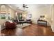 Cozy living room featuring hardwood floors and leather seating at 4614 E Reins Rd, Gilbert, AZ 85297