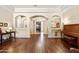 Grand home entryway featuring hardwood floors and elegant archways and furnishings at 4614 E Reins Rd, Gilbert, AZ 85297