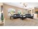 Cozy living room featuring a fireplace, comfortable seating, and ample natural light at 4614 E Reins Rd, Gilbert, AZ 85297