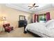 Spacious main bedroom featuring a large bed, dresser, and access to an outdoor space at 4614 E Reins Rd, Gilbert, AZ 85297