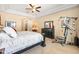 Bright main bedroom with a tray ceiling and large windows, offering ample natural light and comfort at 4614 E Reins Rd, Gilbert, AZ 85297