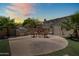 Outdoor BBQ and fireplace on custom patio with ample space is perfect for entertainment and relaxation at 4614 E Reins Rd, Gilbert, AZ 85297