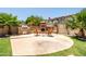 Well-appointed outdoor kitchen with BBQ and fireplace, creating an ideal space for entertainment and relaxation at 4614 E Reins Rd, Gilbert, AZ 85297