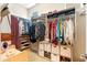 Organized walk-in closet with shelves, drawers, and hanging rods at 4614 E Reins Rd, Gilbert, AZ 85297