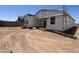Backyard of a home under construction with scaffolding, showing the property's potential at 47437 W Kenner Dr, Maricopa, AZ 85139