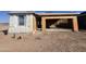 Exterior home under construction featuring a garage and window frames at 47437 W Kenner Dr, Maricopa, AZ 85139