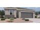 Charming single-story home featuring a two-car garage and neutral color palette at 47437 W Kenner Dr, Maricopa, AZ 85139