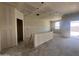Spacious, open-concept living room during construction, ready for personalized finishing touches at 47437 W Kenner Dr, Maricopa, AZ 85139