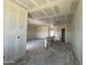 Spacious, open-concept living room during construction, ready for personalized finishing touches at 47437 W Kenner Dr, Maricopa, AZ 85139