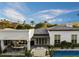 Aerial shot reveals a pristine backyard with a sparkling pool, covered patio, and meticulously landscaped grounds at 5700 E Sanna St, Paradise Valley, AZ 85253