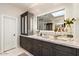 Bathroom features marble countertops, modern fixtures, and custom cabinets for storage at 5700 E Sanna St, Paradise Valley, AZ 85253