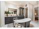 This bathroom features a stand alone tub, walk-in shower, marble countertops, and custom cabinets at 5700 E Sanna St, Paradise Valley, AZ 85253