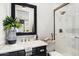 Chic bathroom with marble vanity, decorative mirror, tiled shower, and tasteful accessories for a spa-like feel at 5700 E Sanna St, Paradise Valley, AZ 85253