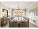 Elegant dining room with statement chandelier, sideboard, and seating for ten at 5700 E Sanna St, Paradise Valley, AZ 85253