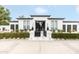Stunning property with a gated entrance, manicured landscaping, and modern architecture at 5700 E Sanna St, Paradise Valley, AZ 85253