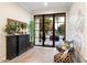 Bright foyer featuring stylish furniture, herringbone floors, and natural light at 5700 E Sanna St, Paradise Valley, AZ 85253