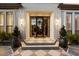 Stunning front entrance featuring a black framed glass door and tiled steps at 5700 E Sanna St, Paradise Valley, AZ 85253