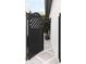 Stylish black gate leads to a well-maintained walkway and garden at 5700 E Sanna St, Paradise Valley, AZ 85253