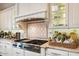 Gourmet kitchen with stainless steel appliances and custom tile backsplash at 5700 E Sanna St, Paradise Valley, AZ 85253