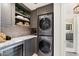 Convenient laundry area with stacked washer/dryer and ample storage at 5700 E Sanna St, Paradise Valley, AZ 85253