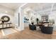 Spacious living room featuring coffered ceilings, a wet bar, and custom built-ins at 5700 E Sanna St, Paradise Valley, AZ 85253