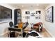 Tastefully decorated home office featuring black accents, wood floors and automotive photography at 5700 E Sanna St, Paradise Valley, AZ 85253