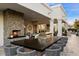 Gourmet outdoor kitchen with a large island, built-in grill, and comfortable seating for entertaining guests at 5700 E Sanna St, Paradise Valley, AZ 85253